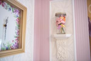 a jar of flowers sitting on a shelf in a room at Tokyo Bay Maihama Hotel First Resort in Urayasu