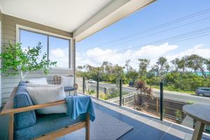 a porch with a couch and a view of a street at Shoreline in Tootgarook