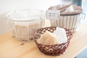 three baskets sitting on a counter with some food at Uwajima Oriental Hotel in Uwajima