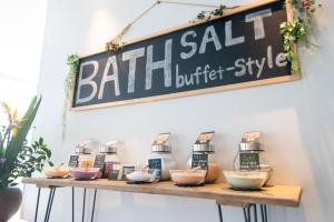 a sign hanging above a shelf with baking ingredients at Uwajima Oriental Hotel in Uwajima