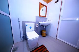 a bathroom with a toilet and a sink at Safari Lodge Yala in Kataragama