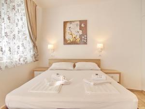 Posteľ alebo postele v izbe v ubytovaní Apartments Sweet Escape