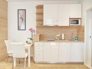 Kuchyňa alebo kuchynka v ubytovaní Apartments Sweet Escape