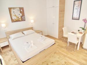 Posteľ alebo postele v izbe v ubytovaní Apartments Sweet Escape