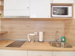 Kuchyňa alebo kuchynka v ubytovaní Apartments Sweet Escape