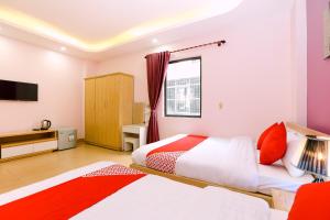 Postel nebo postele na pokoji v ubytování Tuan Anh Hotel