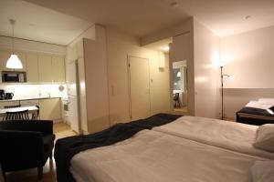 Postel nebo postele na pokoji v ubytování Hotel Aakenus Apartment Vartio with free parking