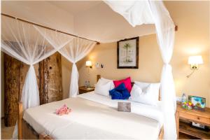 Voodi või voodid majutusasutuse Clove Island Villas & Spa toas