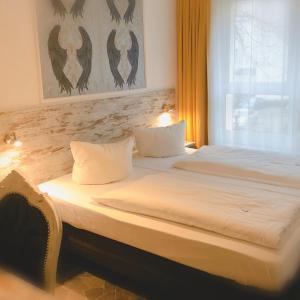 Ein Bett oder Betten in einem Zimmer der Unterkunft Hotel Kiez Pension Berlin
