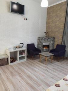 TV a/nebo společenská místnost v ubytování Mini Hotel na Gasheka