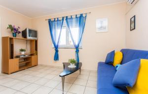 Telewizja i/lub zestaw kina domowego w obiekcie Apartmani Andreas