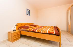 Łóżko lub łóżka w pokoju w obiekcie Apartmani Andreas