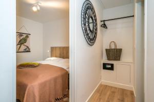 Postel nebo postele na pokoji v ubytování De Herberg Appartementen