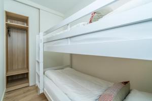Postel nebo postele na pokoji v ubytování De Herberg Appartementen