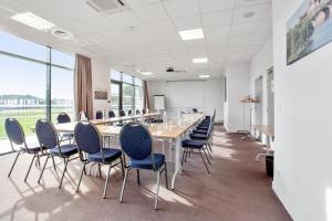 a conference room with a long table and chairs at Toulouse Fluvia in Toulouse