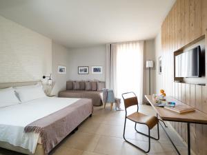 A bed or beds in a room at Rocca dei Saraceni