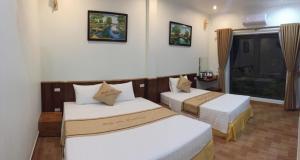 Giường trong phòng chung tại Tam Coc Minh Gia Homestay