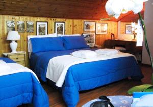 Postel nebo postele na pokoji v ubytování Hotel Bucaneve