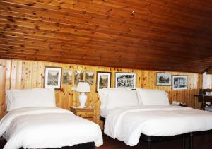 Postel nebo postele na pokoji v ubytování Hotel Bucaneve