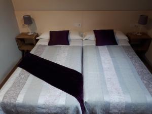 A bed or beds in a room at Ultreia