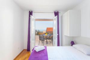 Postel nebo postele na pokoji v ubytování Apartments Dora