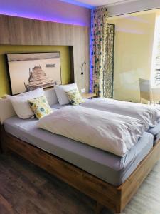 Cama ou camas em um quarto em Weinquartier Burggarten