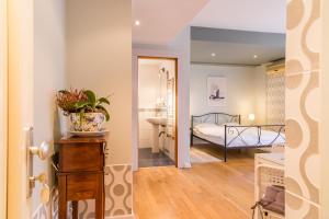 Ένα ή περισσότερα κρεβάτια σε δωμάτιο στο Nostalgia Central Studio II