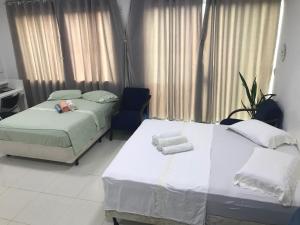 מיטה או מיטות בחדר ב-Casa Térreo