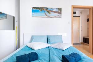 A bed or beds in a room at Matthias Home Midtown Budapest