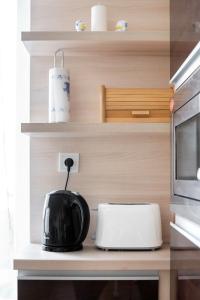 A kitchen or kitchenette at Matthias Home Midtown Budapest