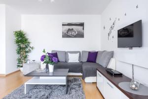 A television and/or entertainment centre at Matthias Home Midtown Budapest