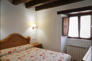Cama o camas de una habitación en Hotel Rural La Puebla
