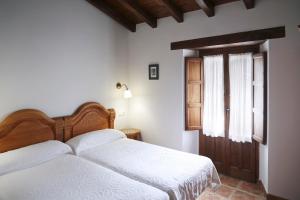 Cama o camas de una habitación en Hotel Rural La Puebla