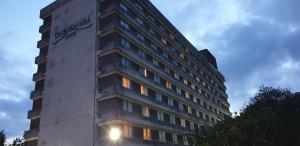 a tall building with a sign on the side of it at Coventry Hill Hotel in Coventry