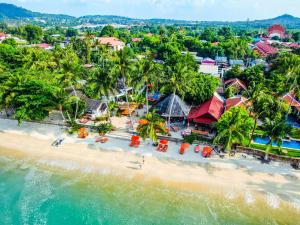 an aerial view of a beach with palm trees at Secret Garden Beach Resort in Bangrak Beach