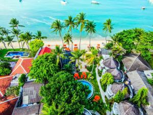 an aerial view of a resort with the beach in the background at Secret Garden Beach Resort in Bangrak Beach