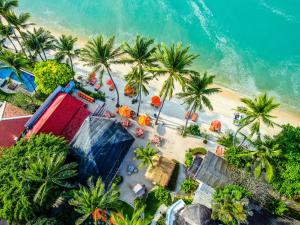 an overhead view of a beach with palm trees at Secret Garden Beach Resort in Bangrak Beach