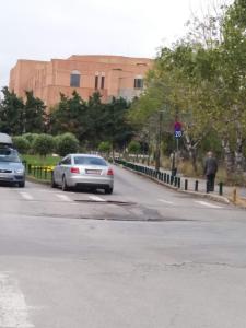 two cars parked on the side of a street at La Petite Maison Nicole in Thessaloniki