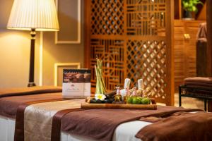 Postel nebo postele na pokoji v ubytování Hong Ngoc Dynastie Boutique Hotel & Spa