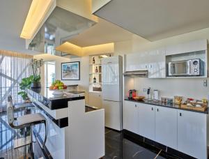 Η κουζίνα ή μικρή κουζίνα στο Sodeco Suites