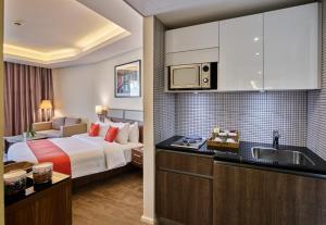 Ένα ή περισσότερα κρεβάτια σε δωμάτιο στο Sodeco Suites