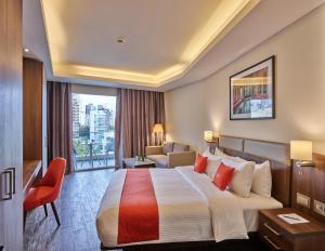 Ένα ή περισσότερα κρεβάτια σε δωμάτιο στο Sodeco Suites