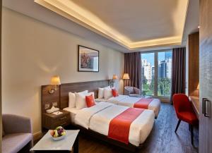 Ένα ή περισσότερα κρεβάτια σε δωμάτιο στο Sodeco Suites