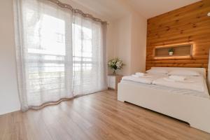 Posteľ alebo postele v izbe v ubytovaní Apartamenty Na Szczycie z balkonem - Dream Apart