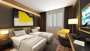 TV a/nebo společenská místnost v ubytování Maccani Black Luxury Suites + 37 fotografií