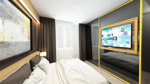 TV a/nebo společenská místnost v ubytování Maccani Black Luxury Suites