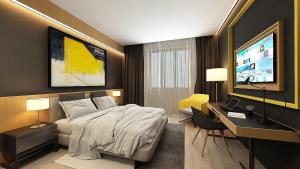 TV a/nebo společenská místnost v ubytování Maccani Black Luxury Suites