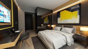 TV a/nebo společenská místnost v ubytování Maccani Black Luxury Suites