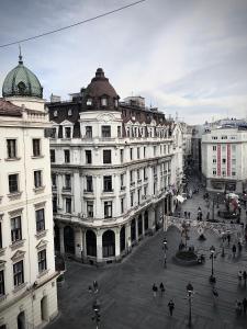 a group of buildings in a city with a street at Knez Mihailova, Beograd in Belgrade
