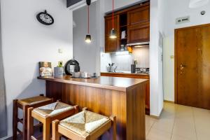 a kitchen with a wooden counter and a table at Apartment 11 in Sofia